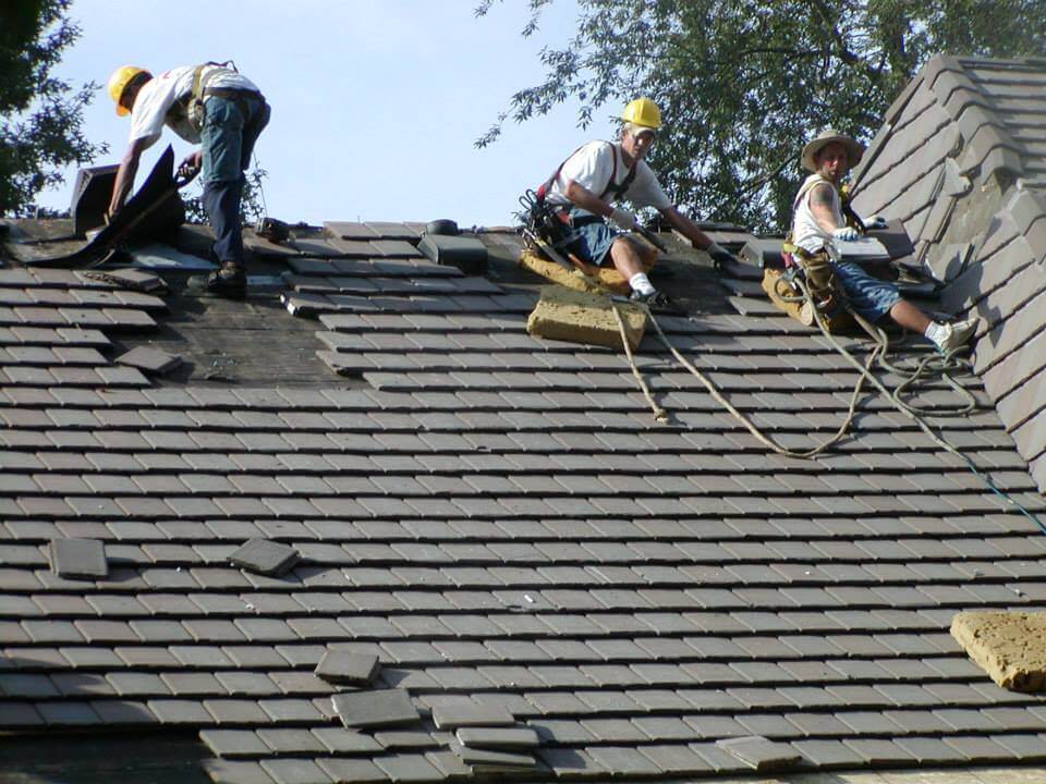 Several roofers on a roof project
